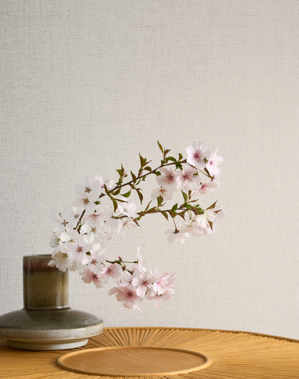 Caractère wallpaper in Soft White by Natty & Polly, styled in a living room
