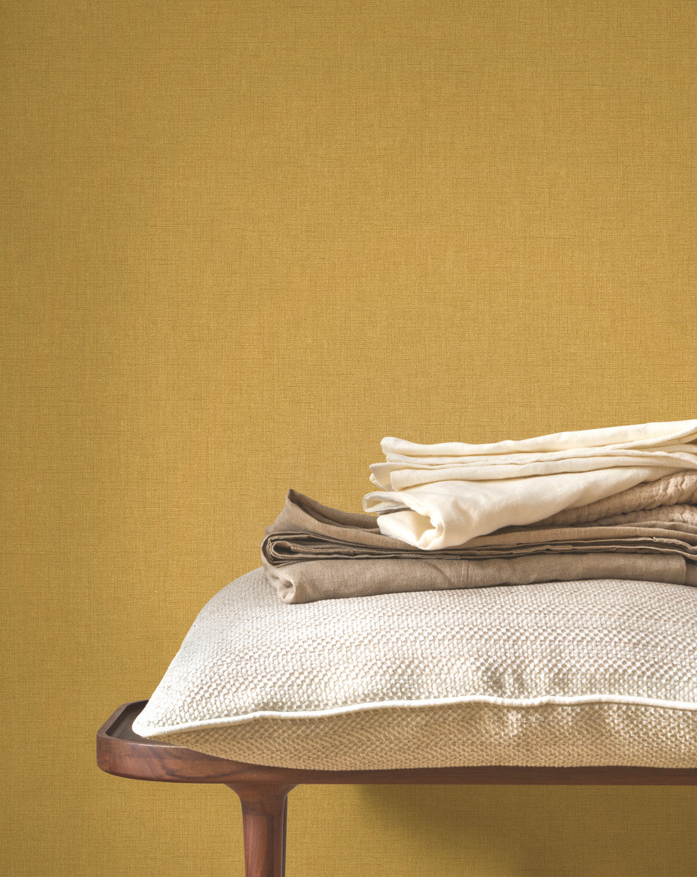 Caractère wallpaper in Mustard Yellow by Natty & Polly, styled in a living room