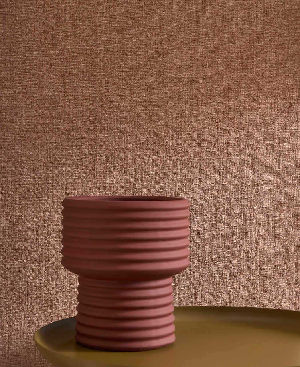 Caractère wallpaper in Mocha by Natty & Polly, styled in a living room
