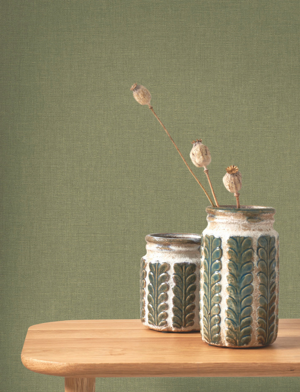 Caractère wallpaper in Leaf Green by Natty & Polly, styled in a living room