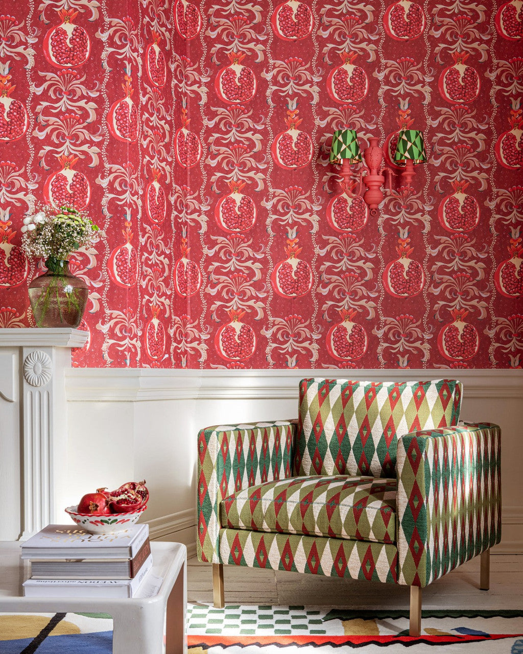 Melagranata wallpaper in Red by Natty & Polly, styled in a living room