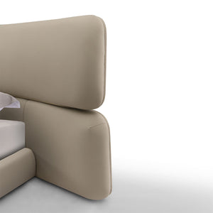 Maison Debrah Aurel contoured upholstered bed with metal decorative details