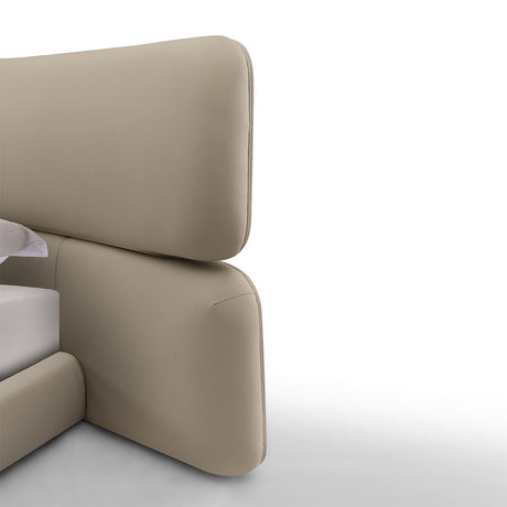 Maison Debrah Aurel contoured upholstered bed with metal decorative details