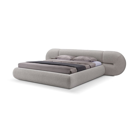 Maison Debrah Calyx sculpted fully upholstered bed on black lacquered metal legs