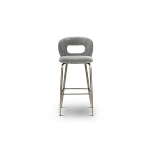Maison Debrah Estrin grey bouclé bar chair with open-back cutout and brushed bronze frame