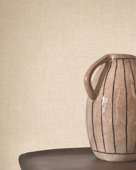 Caractère wallpaper in Beige Champagne by Natty & Polly, styled in a living room