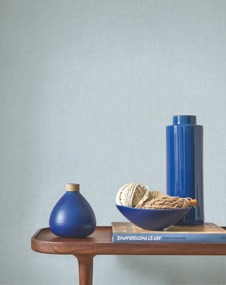 Caractère wallpaper in Sky Blue by Natty & Polly, styled in a living room