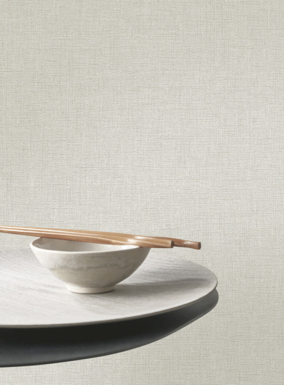 Caractère wallpaper in Feather Grey by Natty & Polly, styled in a living room