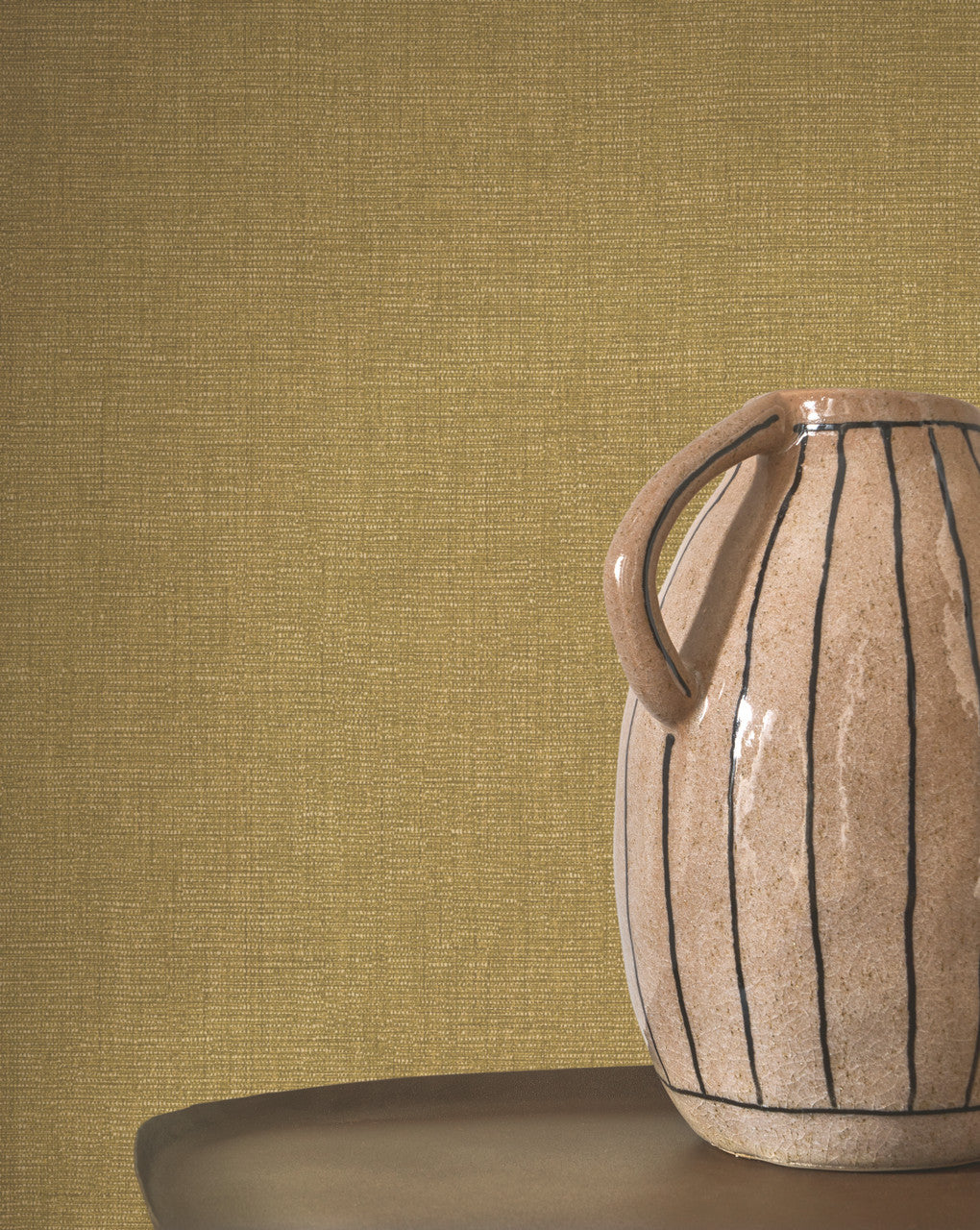 Caractère wallpaper in Olive by Natty & Polly, styled in a living room