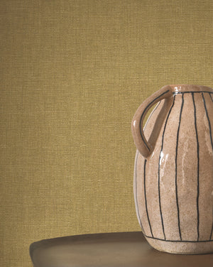 Caractère wallpaper in Olive by Natty & Polly, styled in a living room