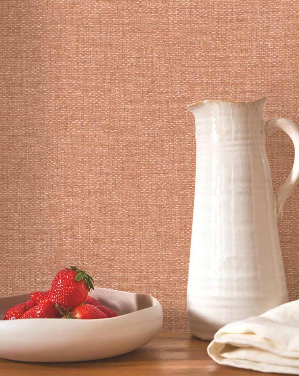 Caractère wallpaper in Terracotta by Natty & Polly, styled in a living room