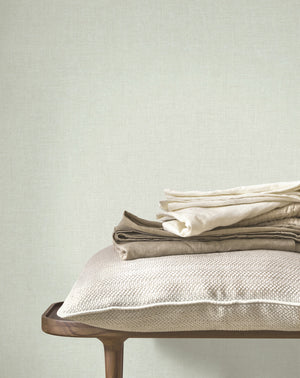 Caractère wallpaper in Water Green by Natty & Polly, styled in a living room