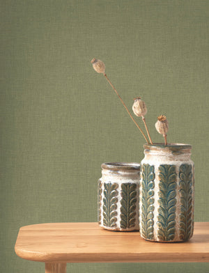 Caractère wallpaper in Leaf Green by Natty & Polly, styled in a living room