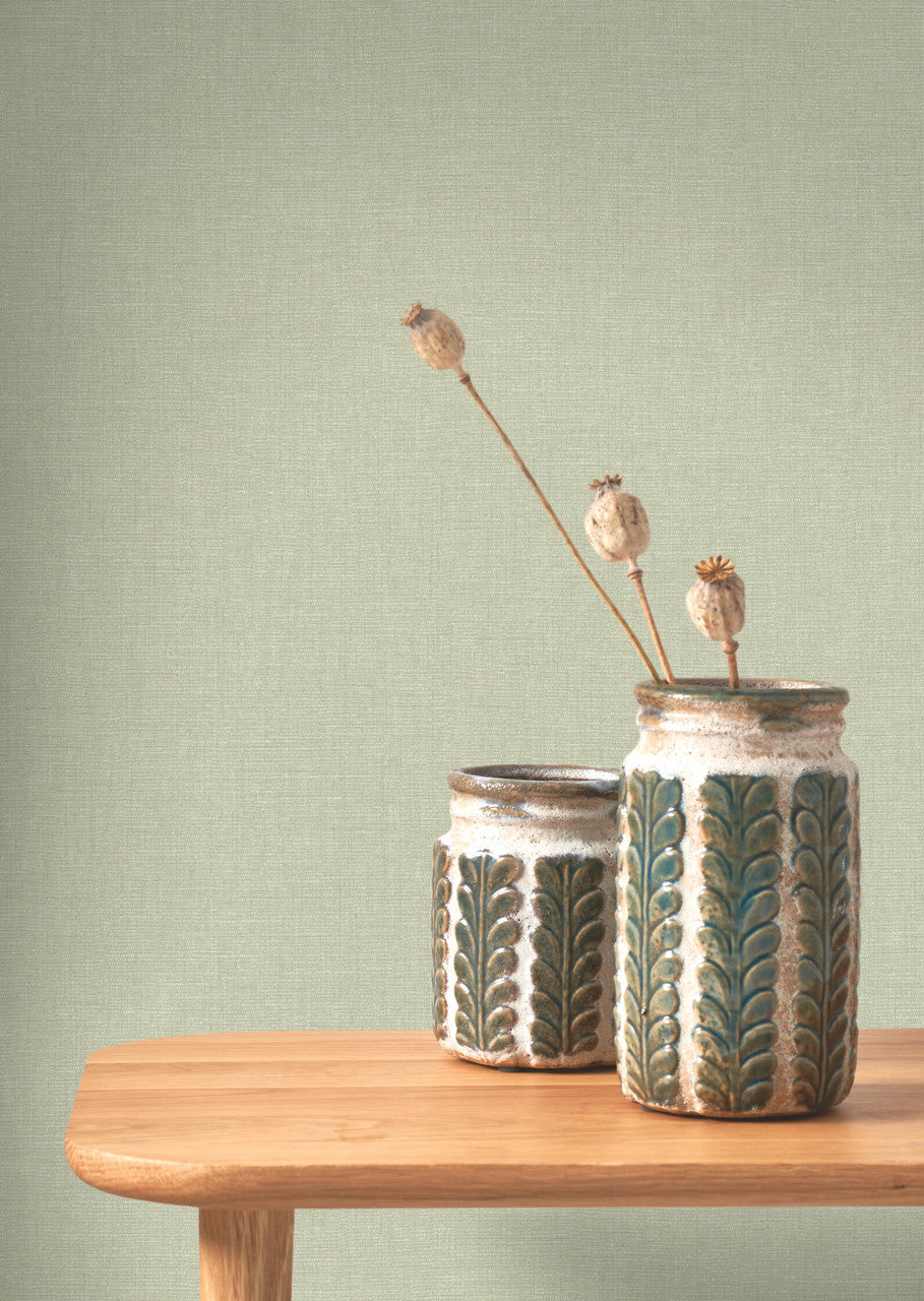 Caractère wallpaper in Opal Green by Natty & Polly, styled in a living room