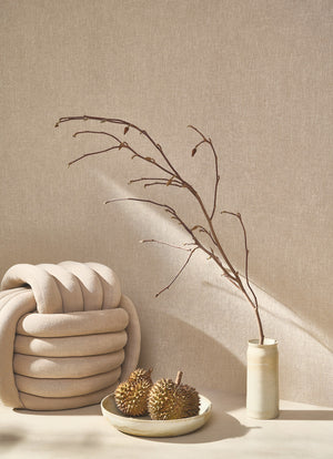 Caractère wallpaper in Taupe by Natty & Polly, styled in a living room