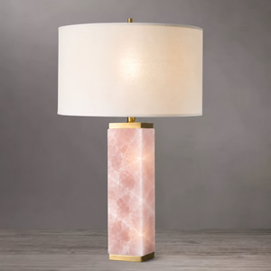 Rose quartz Serra table lamp against a pale grey background showing the pink stone veining