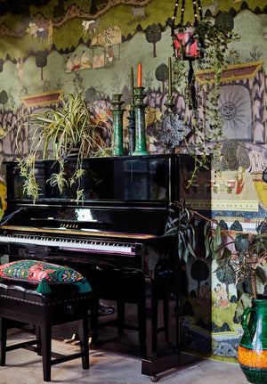 Peace and Music wallpaper in Multi by Natty & Polly, styled in an interior