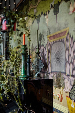 Peace and Music wallpaper in Multi by Natty & Polly, styled in an interior