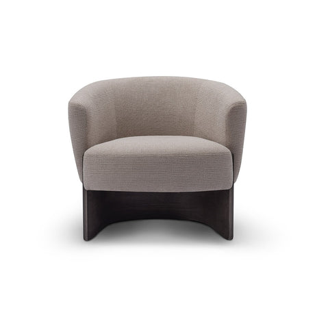 Maison Debrah Rexor curved tub armchair in warm grey woven fabric on an arched dark grey ash base