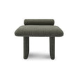 Maison Debrah Jaxel low stool in deep charcoal bouclé with cylindrical bolster and rounded legs