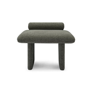 Maison Debrah Jaxel low stool in deep charcoal bouclé with cylindrical bolster and rounded legs