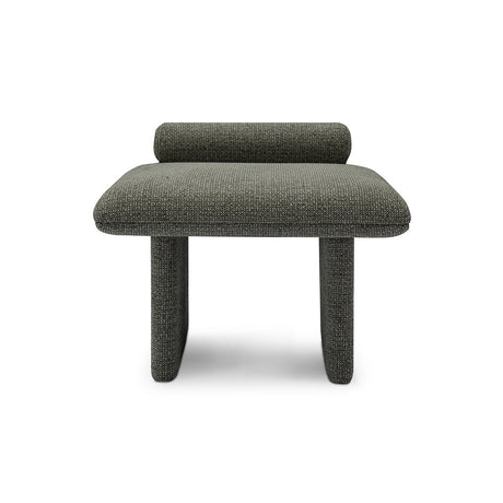 Maison Debrah Jaxel low stool in deep charcoal bouclé with cylindrical bolster and rounded legs