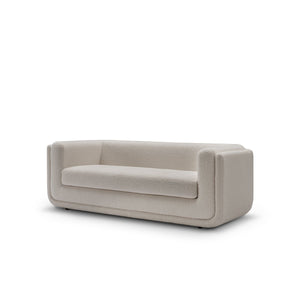 Maison Debrah Oxler low deep-seated boucle sofa on polished gold base