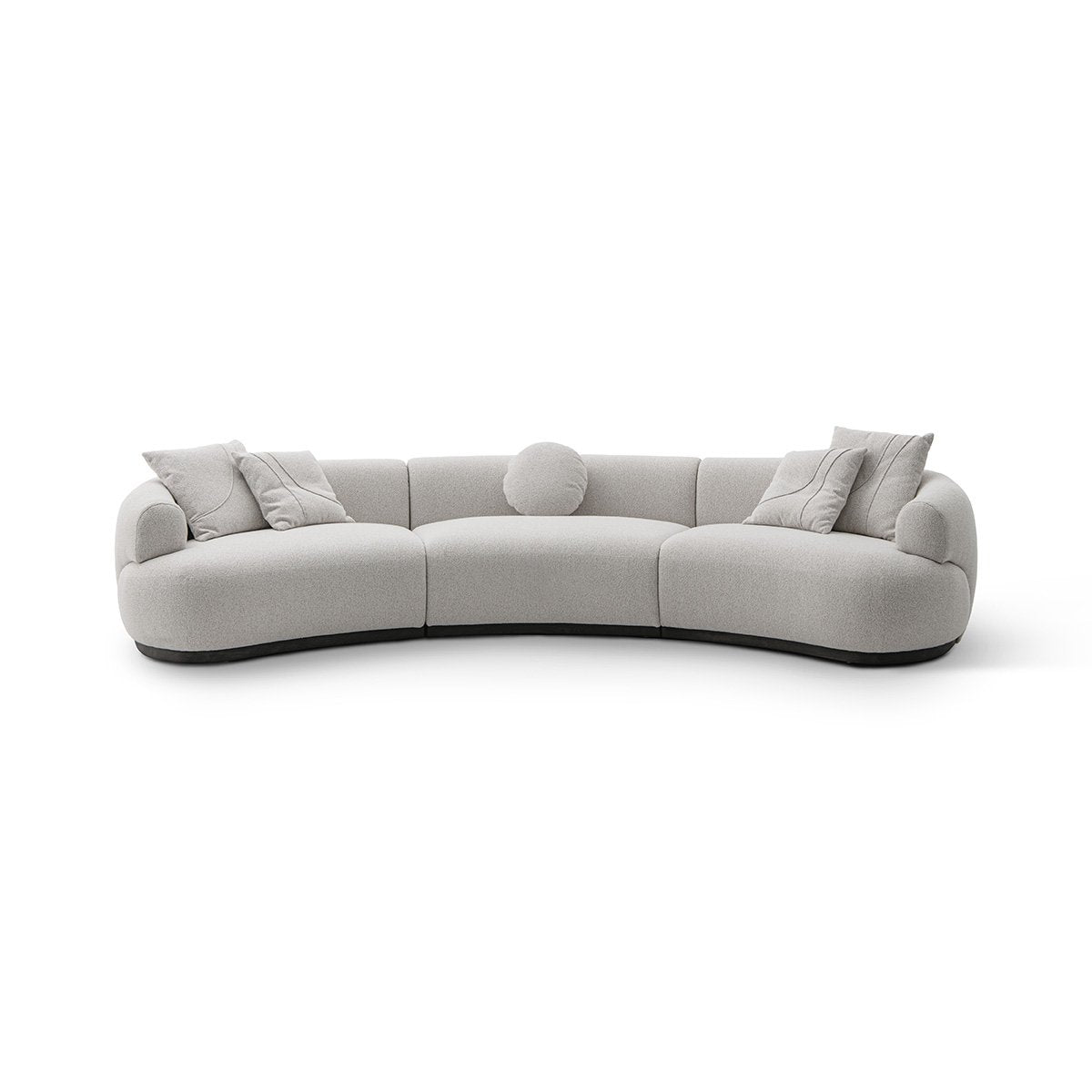 Maison Debrah Lunève curved three-section sofa in warm oatmeal fabric on a dark grey plinth
