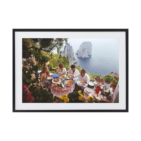 Dining Al Fresco On Capri by Slim Aarons | Framed Photographic Print, Fine Print Co, 195 x 290 mm, Photographic Paper, Black Frame