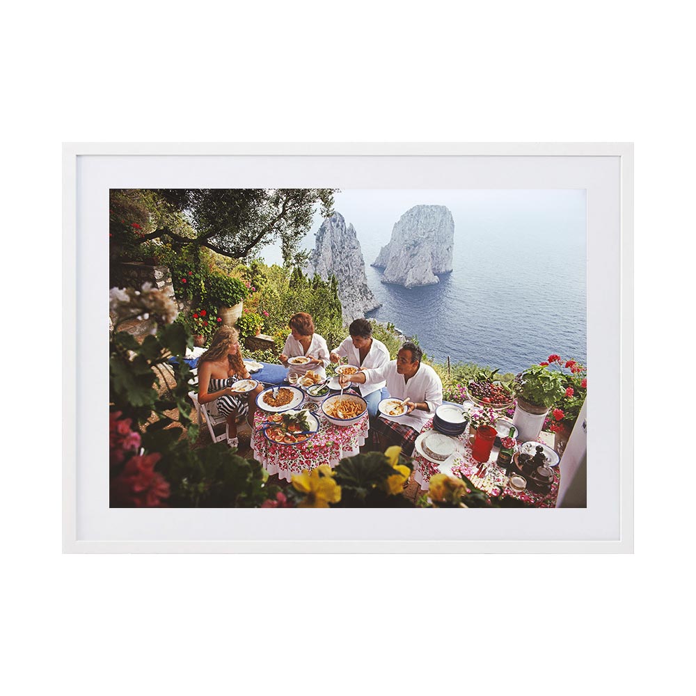 Dining Al Fresco On Capri by Slim Aarons | Framed Photographic Print, Fine Print Co, 195 x 290 mm, Photographic Paper, White Frame