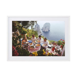 Dining Al Fresco On Capri by Slim Aarons | Framed Photographic Print, Fine Print Co, 195 x 290 mm, Photographic Paper, White Frame