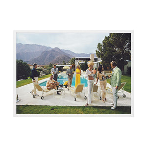 Desert House Party 2 by Slim Aarons | Framed Photographic Print, Fine Print Co, 490 x 730 mm, Canvas, White Frame