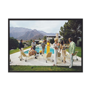 Desert House Party 2 by Slim Aarons | Framed Photographic Print, Fine Print Co, 490 x 730 mm, Canvas, Black Frame