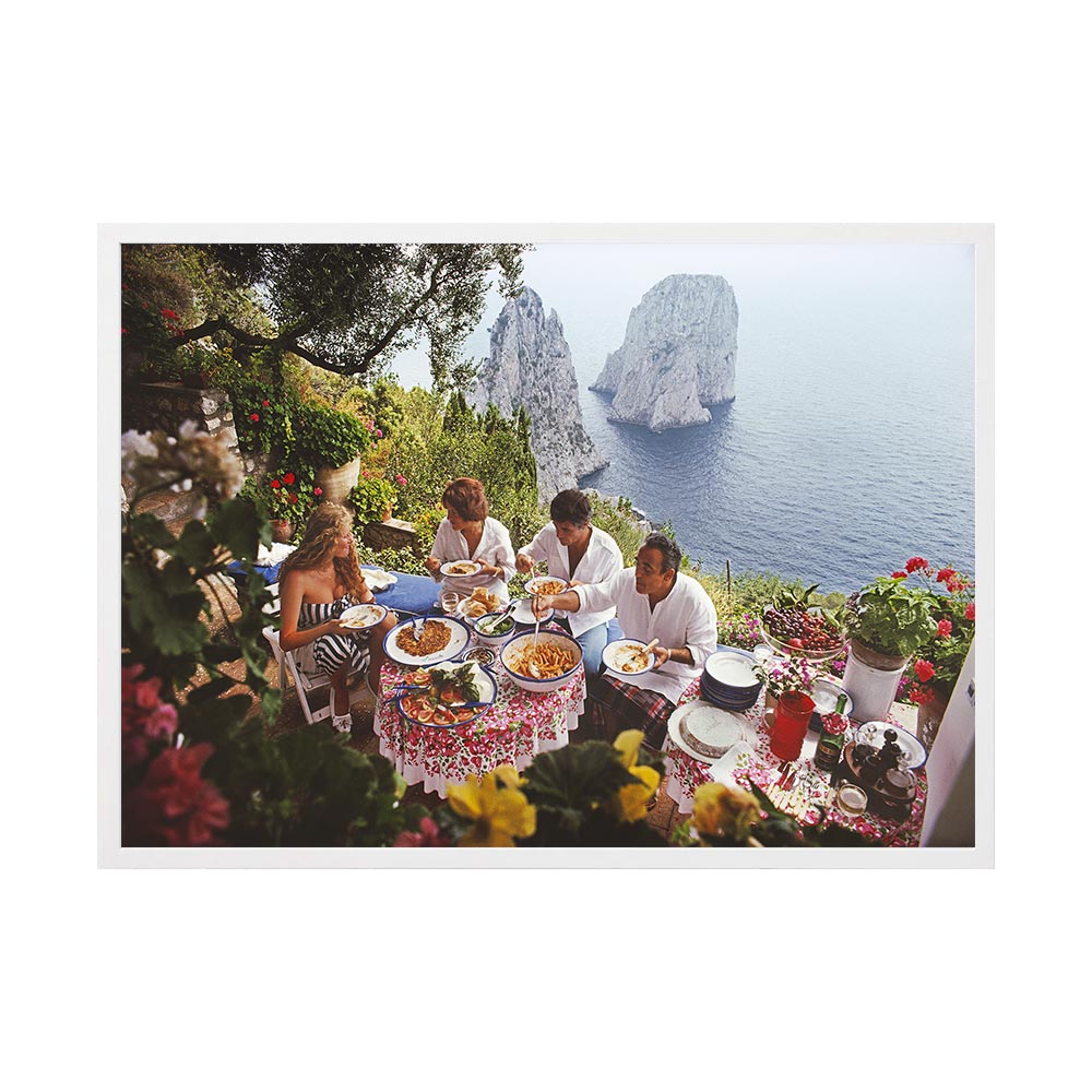 Dining Al Fresco On Capri by Slim Aarons | Framed Photographic Print, Fine Print Co, 490 x 730 mm, Canvas, White Frame